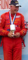 Doug Peterson wins in his Design 500 racing uniform